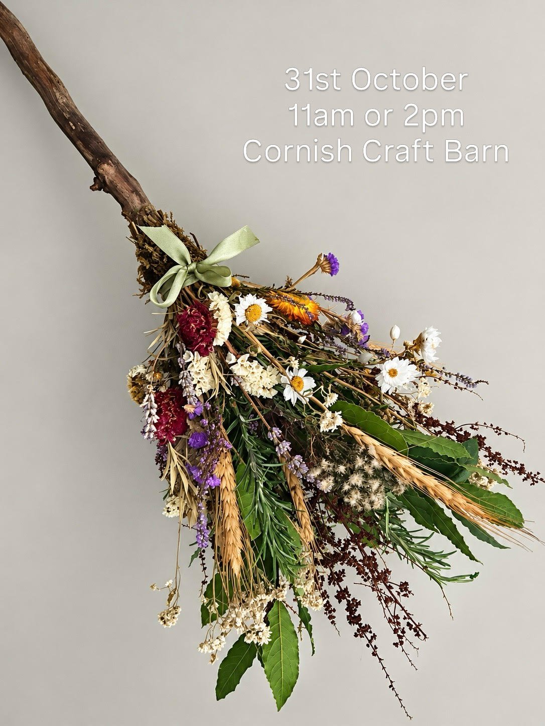 Halloween broomstick decorated with dried autumn leaves, grasses and flowers