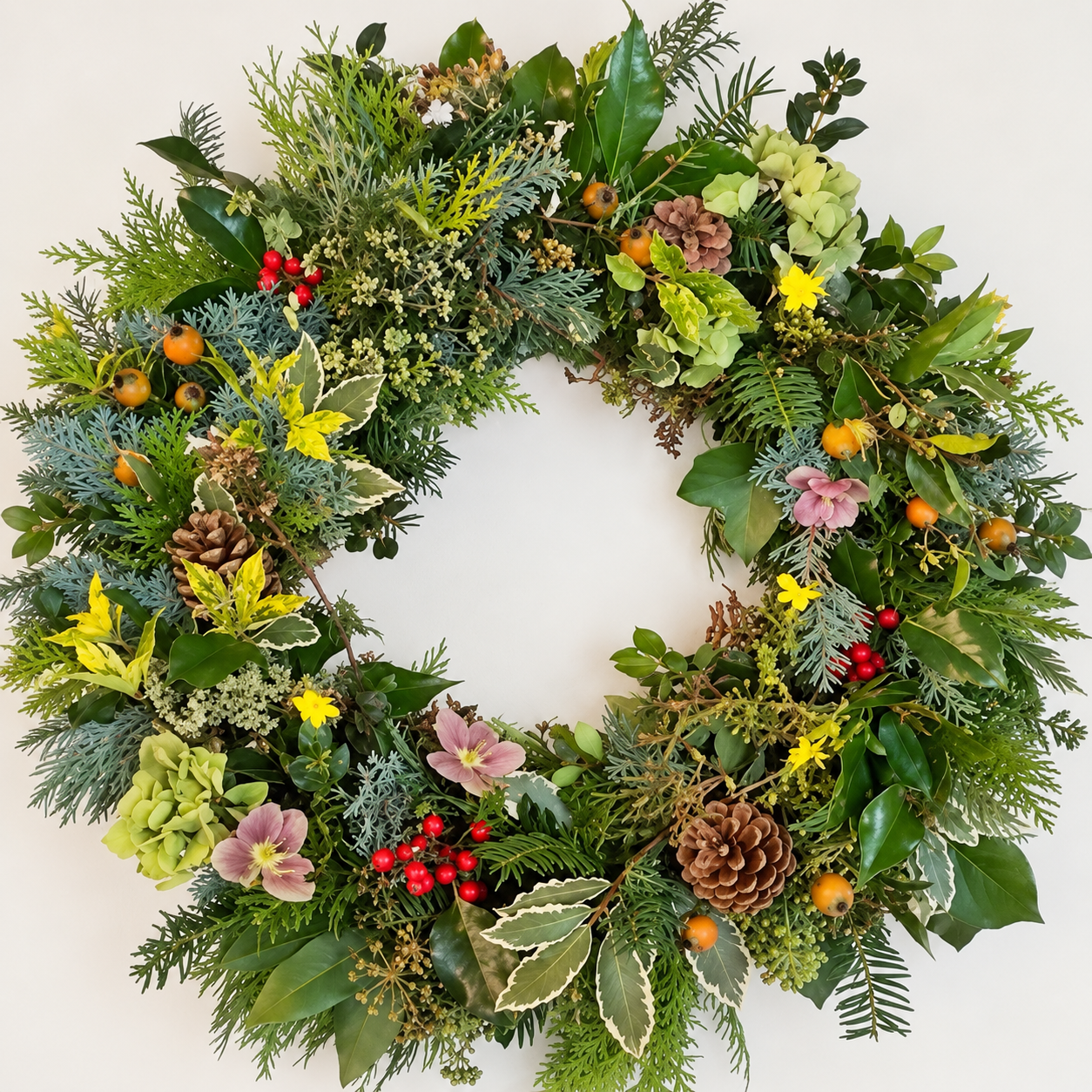 Natural Cornish Christmas wreath with foliage, berries, rosehips and cones